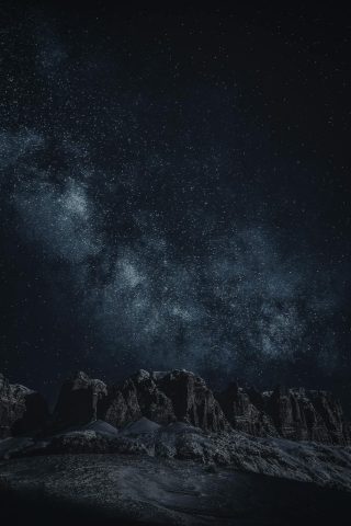 Starry sky with Milky Way over mountains
