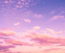 Pink and purple evening sky with clouds Pink and purple clouds in evening sky