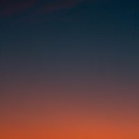 Fiery sunset with crescent moon Crescent moon and fiery orange sunset horizon